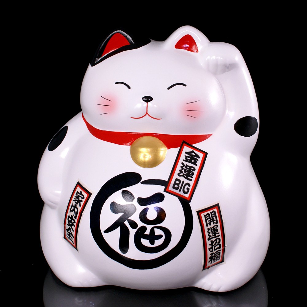 Tirelire chat japonais maneki neko, symbole de bonheur et prospérité.